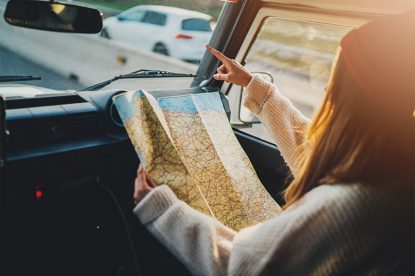 Holding A Map In A Car